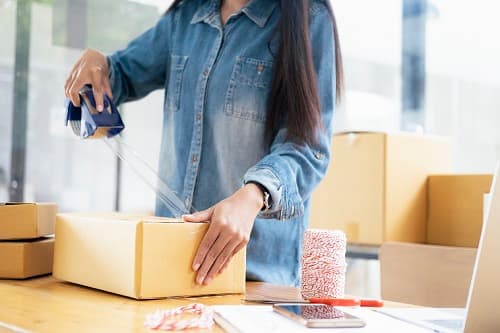 woman packing up a box